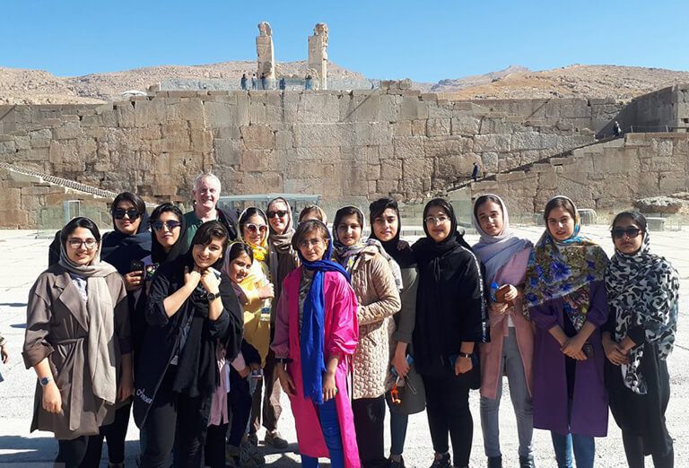 A group of student took a picture with tourists from Northern Ireland in Persepolis