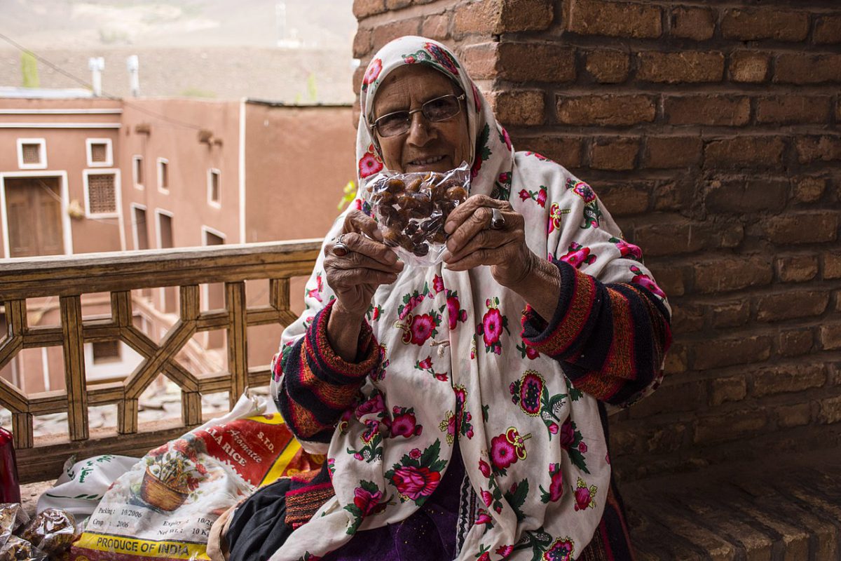 Abyaneh Village-A lady offering food-Isfahan-Iran