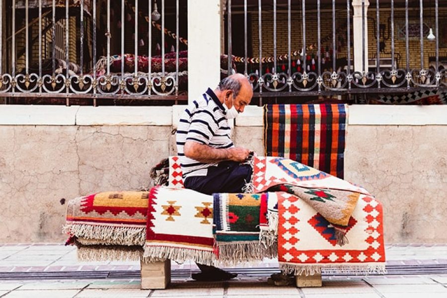 ToIranTour - Man Sellling Persian Carpet in Vakin Bazaar - Shiraz - 10 Days Persian Theme Tour