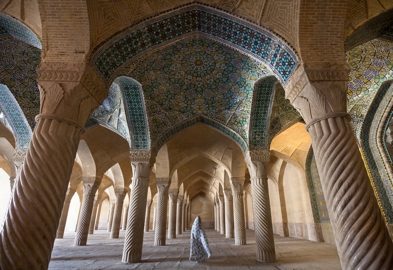 ToIranTour - A woman strolling in the beauty of Vakil Mosque - Shiraz - Iran Classic Tour